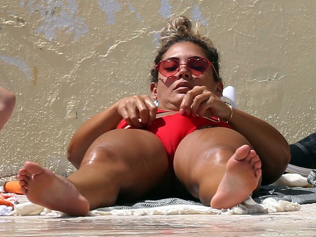 Noni Janur Shows Her Great Ass And Cameltoe In Red Bikini