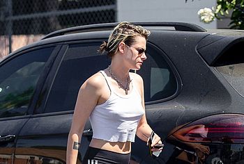Kristen Stewart flashes a sexy smile as she goes 