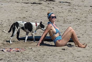 Ireland Baldwin boobs ass on a beach