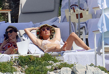Sienna Miller sunbathes