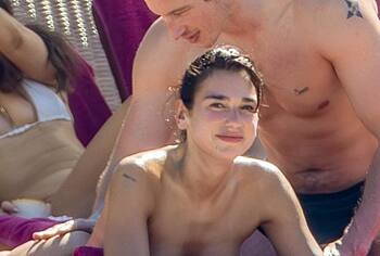 Dua Lipa bikini on a beach