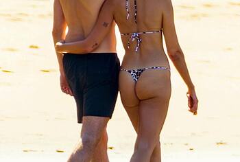 Dua Lipa bikini on a beach