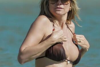 Heidi Klum nude on a beach