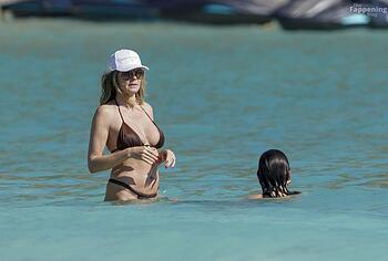 Heidi Klum nude on a beach