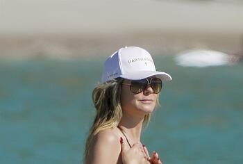 Heidi Klum nude on a beach