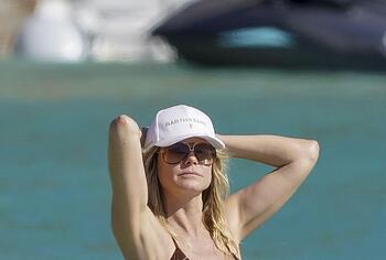 Heidi Klum nude on a beach