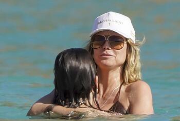 Heidi Klum nude on a beach