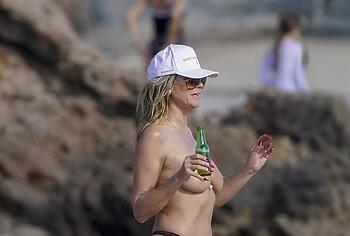 Heidi Klum nude on a beach