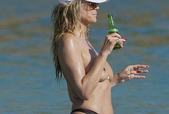 Heidi Klum nude on a beach