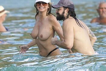 Heidi Klum nude on a beach