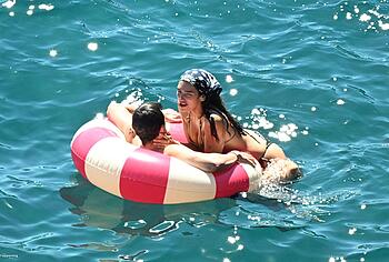 Dua Lipa sexy bikini on a beach