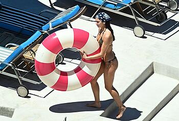 Dua Lipa sexy bikini on a beach