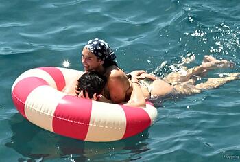 Dua Lipa sexy bikini on a beach