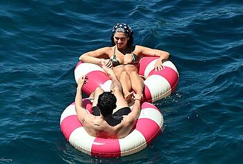 Dua Lipa sexy bikini on a beach