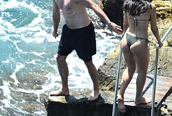 Dua Lipa sexy bikini on a beach