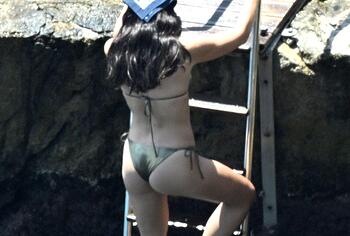 Dua Lipa sexy bikini on a beach