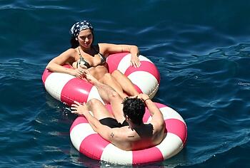 Dua Lipa sexy bikini on a beach