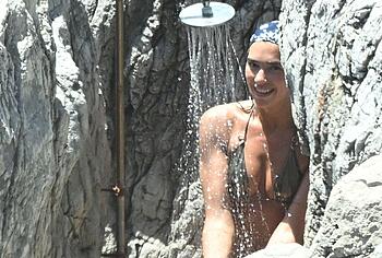 Dua Lipa sexy bikini on a beach