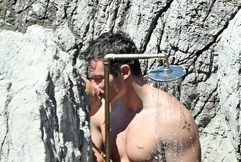 Dua Lipa sexy bikini on a beach