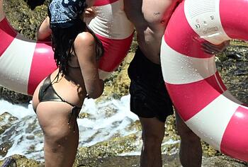 Dua Lipa sexy bikini on a beach
