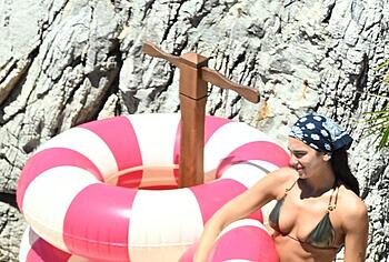Dua Lipa sexy bikini on a beach
