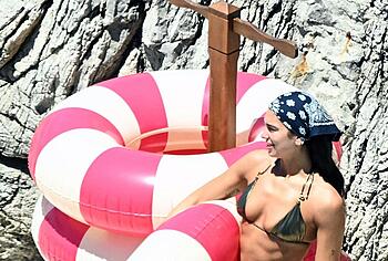 Dua Lipa sexy bikini on a beach