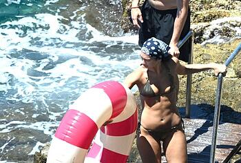 Dua Lipa sexy bikini on a beach