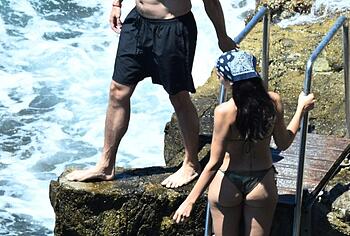 Dua Lipa sexy bikini on a beach