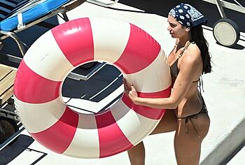 Dua Lipa sexy bikini on a beach