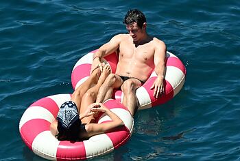 Dua Lipa sexy bikini on a beach