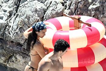 Dua Lipa sexy bikini on a beach