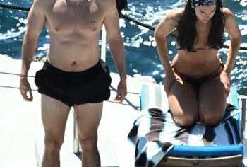 Dua Lipa sexy bikini on a beach