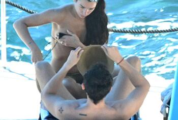 Dua Lipa sexy bikini on a beach