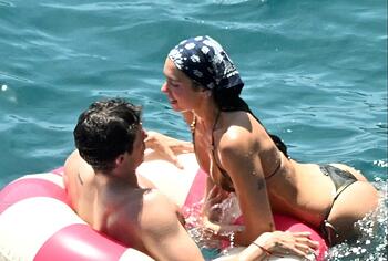 Dua Lipa sexy bikini on a beach