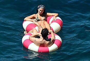 Dua Lipa sexy bikini on a beach