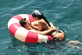 Dua Lipa sexy bikini on a beach