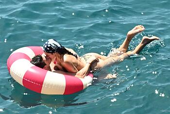 Dua Lipa sexy bikini on a beach